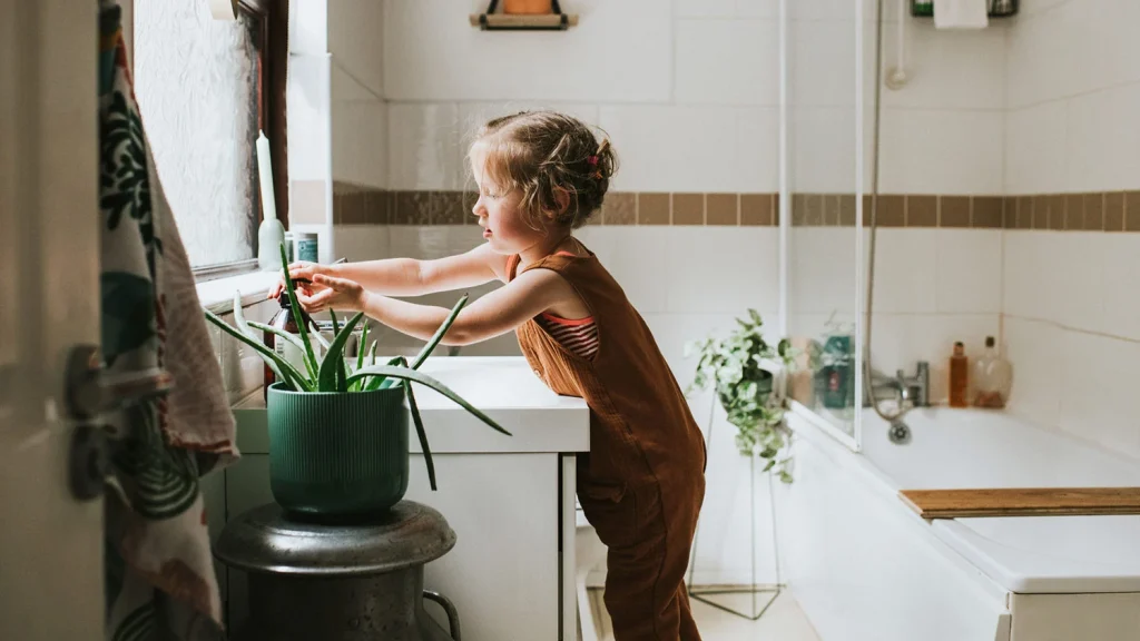 little girl washing hands